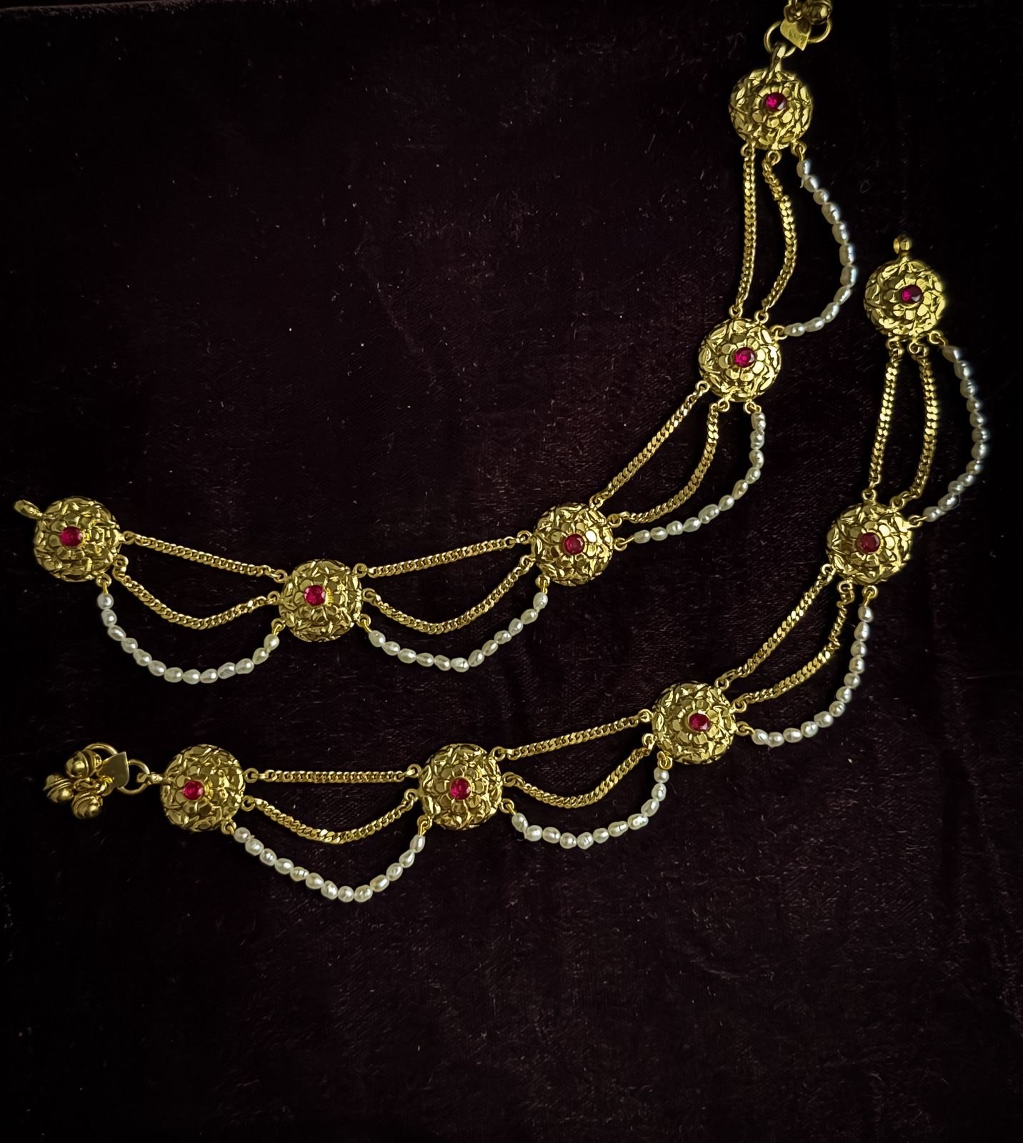 Purity: 92.5 Silver Length: 10" All our products are stamped with purity. We provide a one year guarantee Delivery Time 12- 15 Days Please Note: Some of our jewellery pieces are ready to ship and may be delivered earlier than the estimated time. Made to order creations may take 12- 15 Days. For specific delivery details, please contact us at +91-8017244299. Jewellery Care Your Gahane jewellery is crafted with love and deserves the finest care to retain its timeless beauty. * Keep Away from Moisture Store your pieces in a dry pouch or wrap them in soft cotton muslin cloth. Avoid moisture, as it may damage the surface and finish. * Avoid Perfumes & Sprays Do not sprays perfumes or deodorants directly while wearing the jewellery, as they can corrode the surface and leave marks. * No Water Contact Even a few drops of water can dull the shine. If you’re preparing for a family gathering or celebration, gently clean your jewellery with a soft linen or cotton cloth before wearing. * Safe Storage Moisture can still see in even when stored in boxes. The safest way to protect your jewellery is to wrap them in butter paper or cotton cloth and place them in an airtight container. The butter paper locks out moisture and keeps your jewellery dry. * Regular Cleaning Use a soft suede cloth to wipe your jewellery. For light stains, gently use an eraser, then wipe again. If soiled, apply a little talcum powder with a delicate brush and wipe to maintain the shine. After cleaning, leave the pieces out to air you’ll notice their natural glow return. * Be Gentle with Chemicals if you must clean with chemicals, always using mild options. Diamonds and other gemstones may be cleaned with mild soap and warm water. At Gahane, we believe jewellery is not just an accessory it is heritage. With the right care, your pieces will shine on for generations